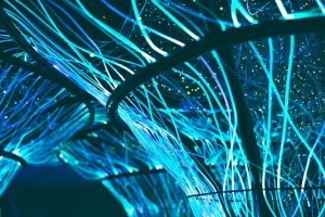An abstract depiction of a dynamic digital news feed with flowing lines and light, representing the constant flow of information and updates from Calumet AI.